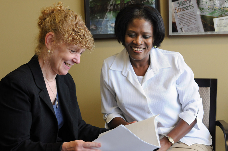Rhonda Mandel, left, dean of the College of Liberal Arts and Sciences, and Webe Kadima, associate professor of chemistry, look over SUNY Oswego’s successful application for a $200,000 grant to study the status of women faculty in science, technology, engineering and math, or STEM, disciplines at the college. Kadima is principal investigator for the two-year National Science Foundation catalyst grant. Researchers aim to learn whether anything — from policies to practices — holds back women in STEM in terms of recruitment, hiring, retention and promotion. The award will help determine whether SUNY Oswego may be a candidate for a much larger “institutional transformation” grant.