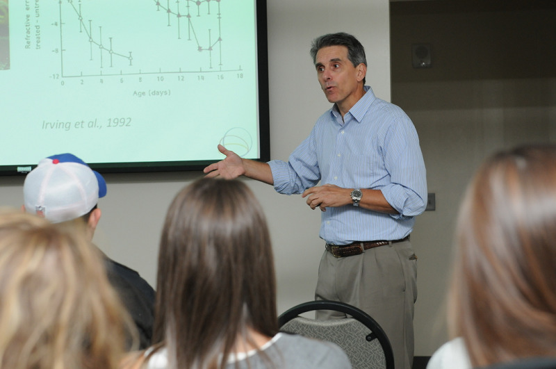 David Troilo ’80, vice president and dean of academic affairs at the SUNY College of Optometry in Manhattan, shares his research on eye development with Oswego students in September.