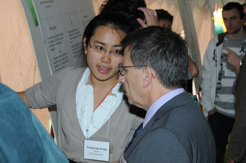 Fengrong Wong ’11 shares her research with President Deborah F. Stanley.