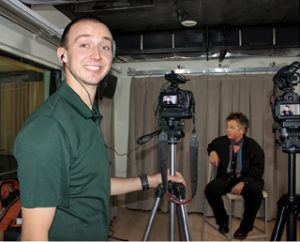 Pictured above is videographer Tyler Edic ’13 and Amy Bartell ’86, an instructor in the art department.