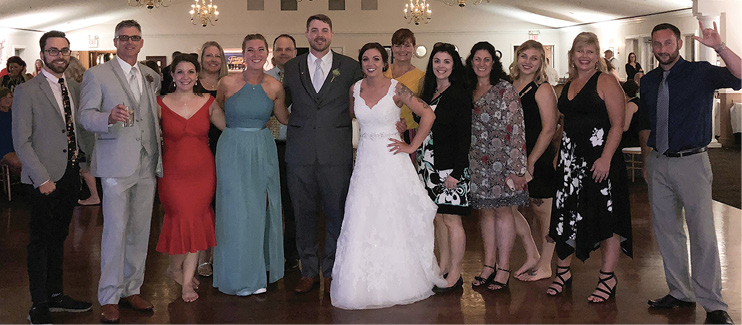 Pictured: Christina Buckingham ’15 and Sean Cooper with friends at their wedding