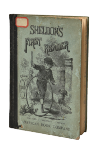 Book Titled "Sheldon's First Reader" - Pictured on cover: drawn children playing hoop trundling