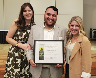 Justin Dobrow ’17 (center) with wife, Kalie Hudson Dobrow ’16, and OAA Executive Director Laura Pavlus Kelly ’09 (right)