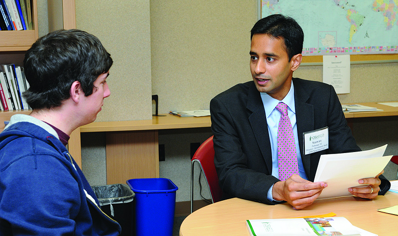 Pathange M ’02 of UBS Securities talks with Brian Gambardella ’12 at last fall’s Alumni Business Symposium.