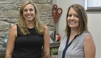  Katie Toomey (left), executive director of the Greater Oswego-Fulton Chamber of Commerce, and Chena Tucker, director of the SUNY Oswego Office of Business and Community Relations