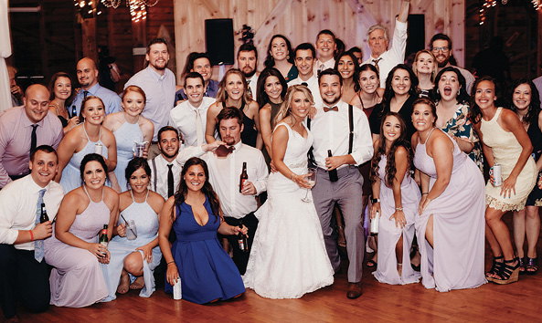 Pictured: Lauren Boyd ’15 and Michael Stairs ’14 with wedding party