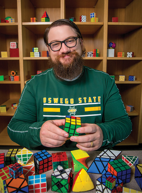 Kenny Roffo '17 and his collection of rubik's cubes